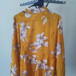 Yellow romper with white flowers